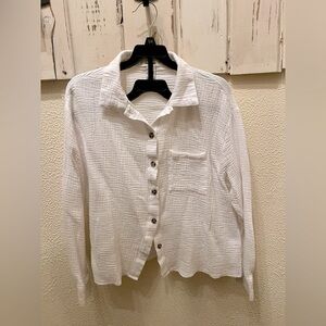 Two piece beach and summer set. Button up top and matching shorts.